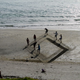 Illustration for article titled These 3D sand drawings create fun trippy illusions on the beach